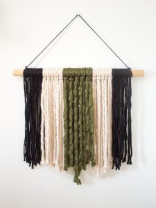 If you're looking for a quick and easy way to fill a blank space on your wall and make a statement, this modern DIY yarn wall hanging is perfect! It's so simple and only takes about 20 minutes start to finish! 