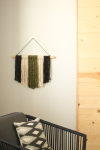 If you're looking for a quick and easy way to fill a blank space on your wall and make a statement, this modern DIY yarn wall hanging is perfect! It's so simple and only takes about 20 minutes start to finish! 