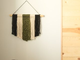 If you're looking for a quick and easy way to fill a blank space on your wall and make a statement, this modern DIY yarn wall hanging is perfect! It's so simple and only takes about 20 minutes start to finish! 