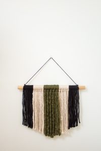 If you're looking for a quick and easy way to fill a blank space on your wall and make a statement, this modern DIY yarn wall hanging is perfect! It's so simple and only takes about 20 minutes start to finish! 