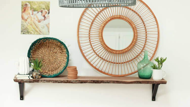 Styled open shelving decorated in boho style. 