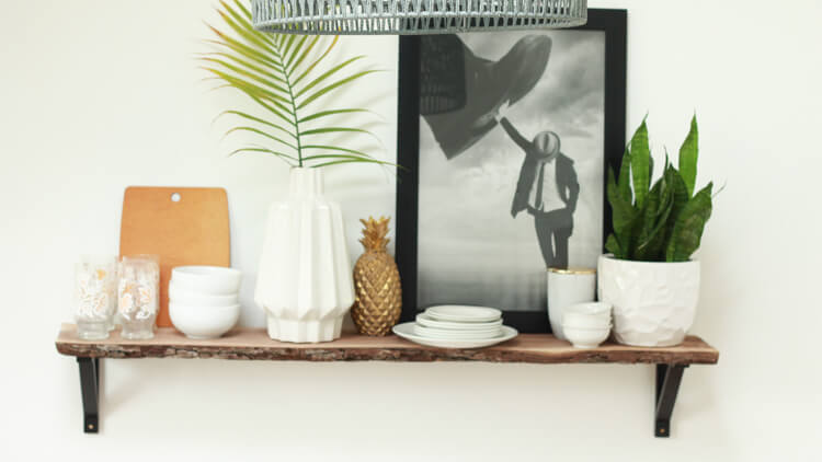 A traditional modern open shelf design featuring dish ware.