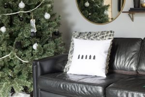 Love this modern Christmas home tour! It's a simple way to mix natural elements with black and white and teal for a classic, modern holiday look!