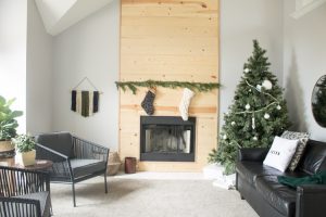 Love this modern Christmas home tour! It's a simple way to mix natural elements with black and white and teal for a classic, modern holiday look!