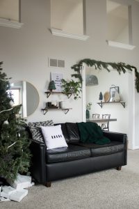 Love this modern Christmas home tour! It's a simple way to mix natural elements with black and white and teal for a classic, modern holiday look!