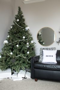 Love this modern Christmas home tour! It's a simple way to mix natural elements with black and white and teal for a classic, modern holiday look!