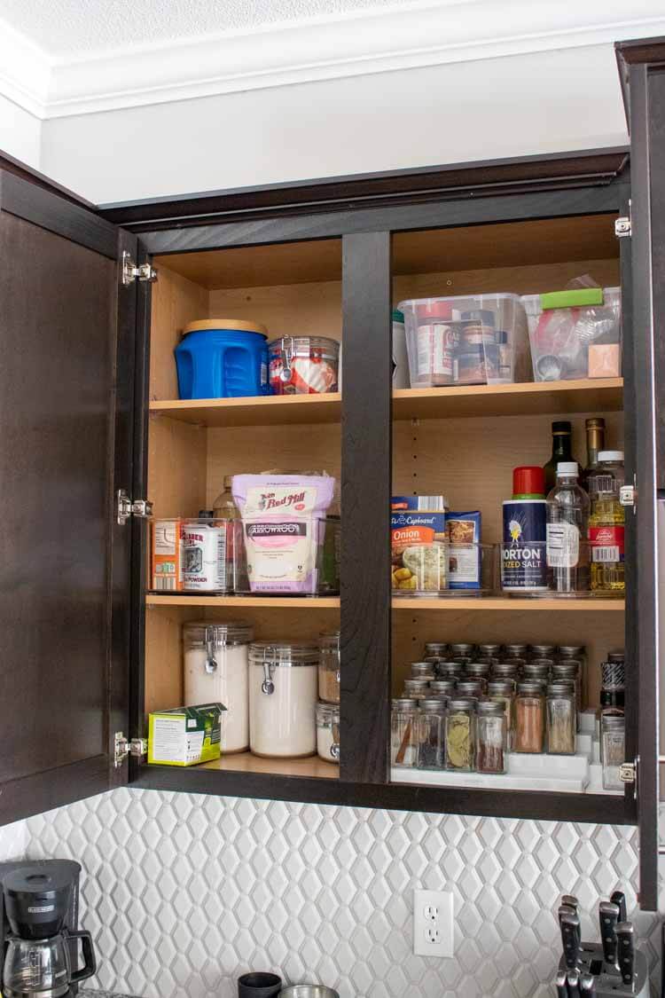 Organized spice cabinet with acrylic organizers from Amazon